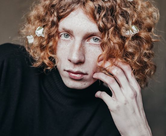 Close up of a man stretching with focus and calm expression